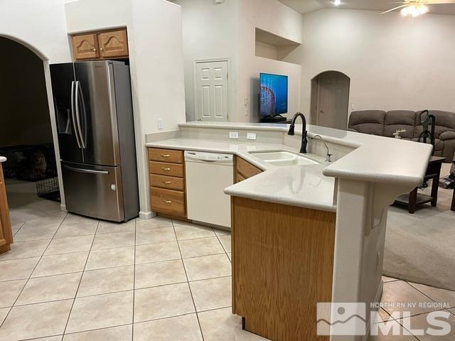 4335 Rancheria Road Fallon, NV 89406 - Photo 11 of 36 a kitchen with a sink cabinets and stainless steel appliances