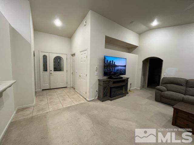 4335 Rancheria Road Fallon, NV 89406 - Photo 12 of 36 a living room with furniture and a flat screen tv