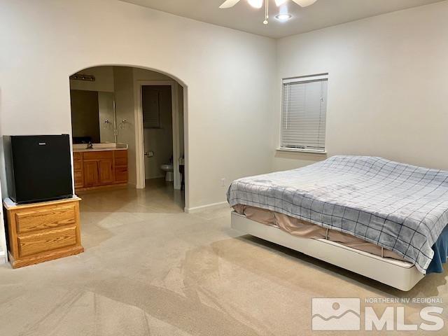 4335 Rancheria Road Fallon, NV 89406 - Photo 16 of 36 a spacious bedroom with a bed and a dresser