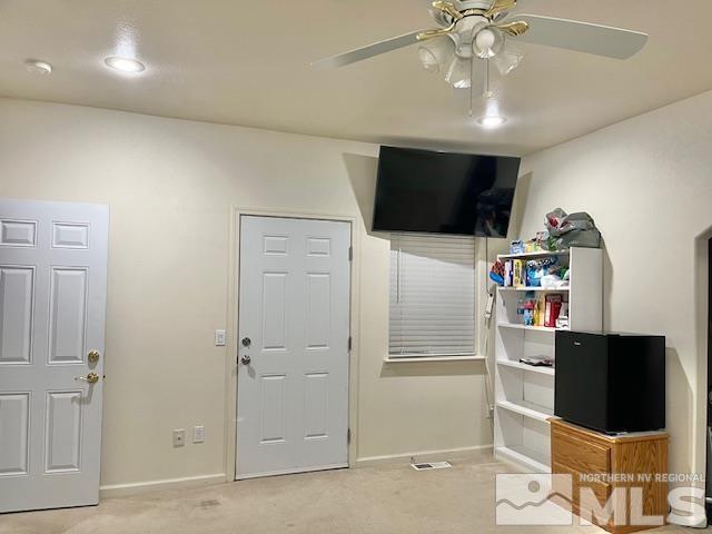 4335 Rancheria Road Fallon, NV 89406 - Photo 17 of 36 a room with a flat screen tv and cabinets