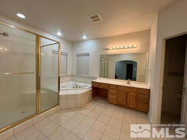 4335 Rancheria Road Fallon, NV 89406 - Photo 18 of 36 a bathroom with a tub sink shower and mirror