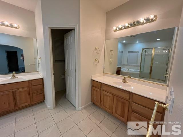 4335 Rancheria Road Fallon, NV 89406 - Photo 20 of 36 a large bathroom with a double vanity sink and a mirror
