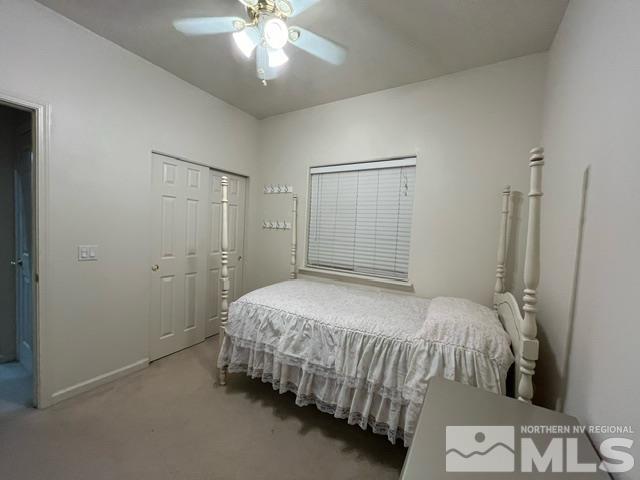 4335 Rancheria Road Fallon, NV 89406 - Photo 23 of 36 a bedroom with a bed and a chandelier
