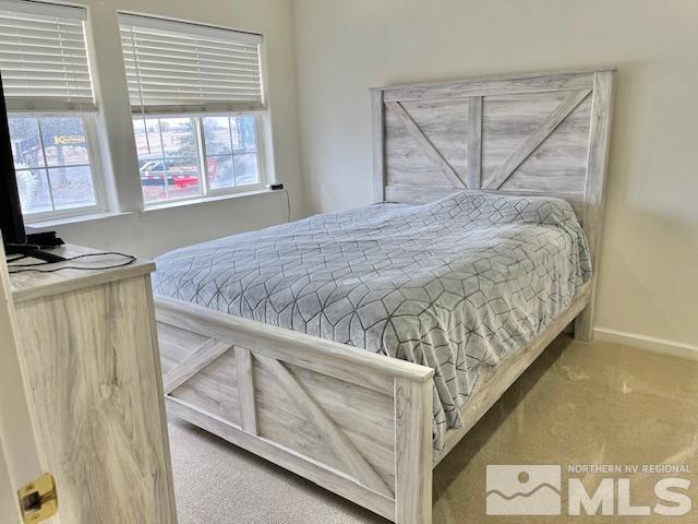 4335 Rancheria Road Fallon, NV 89406 - Photo 24 of 36 a bedroom with a bed and wooden floor
