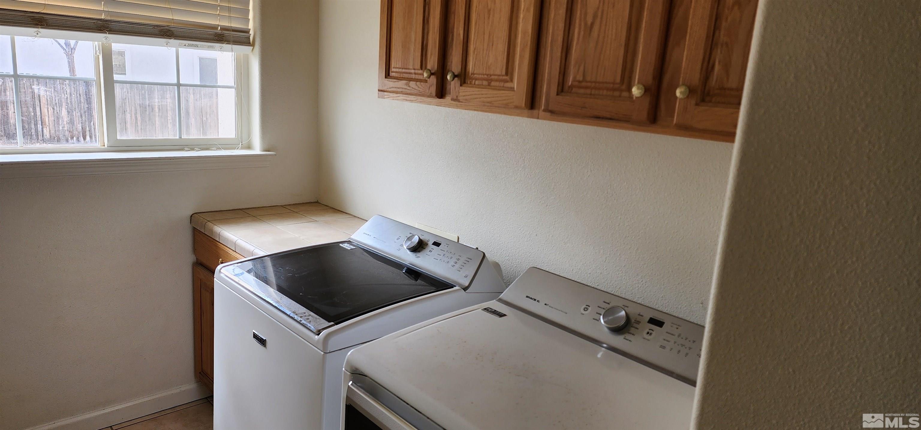 4335 Rancheria Road Fallon, NV 89406 - Photo 26 of 36 a utility room with dryer and washer