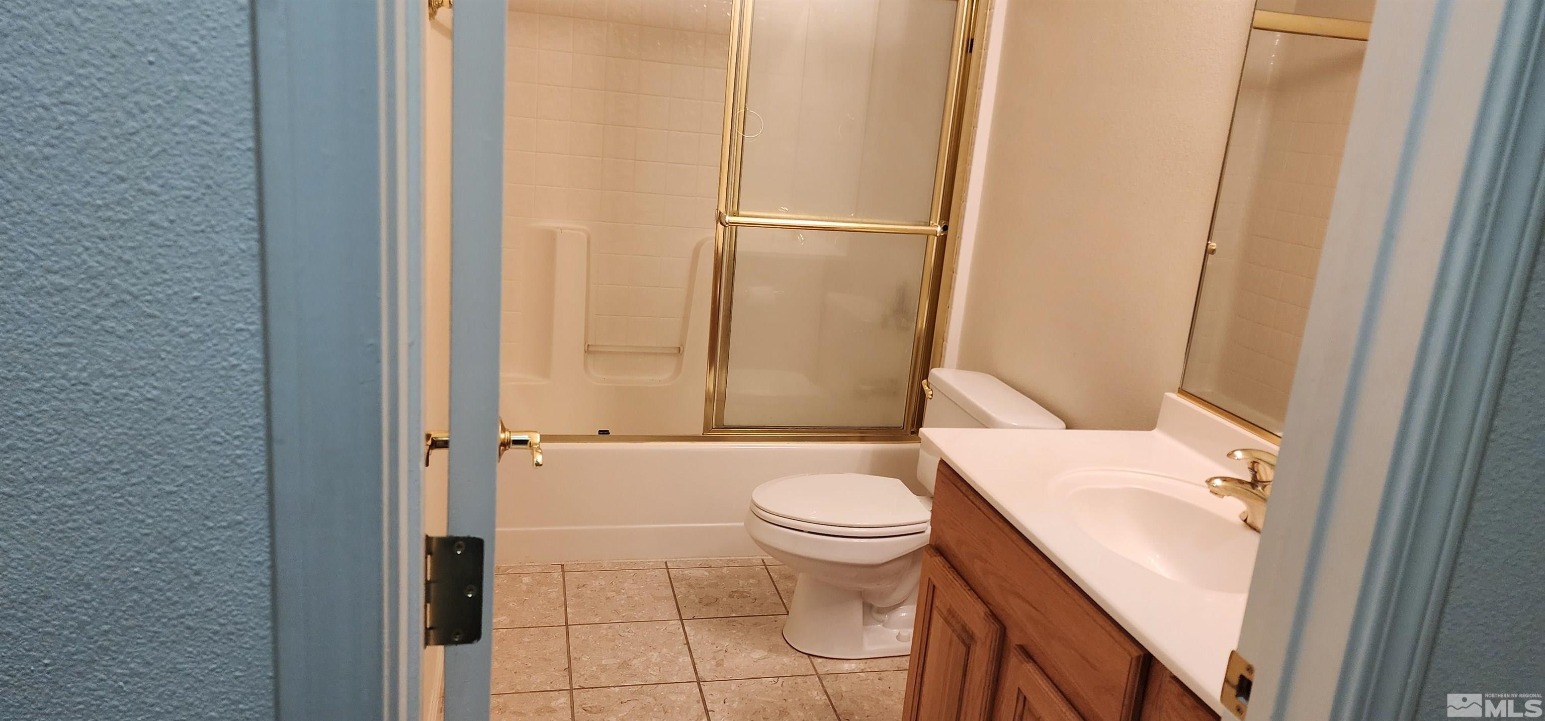 4335 Rancheria Road Fallon, NV 89406 - Photo 27 of 36 a white toilet sitting next to a bathroom sink