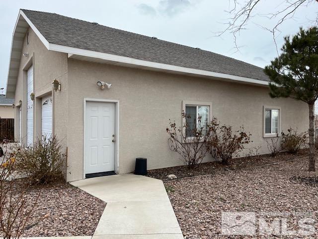 4335 Rancheria Road Fallon, NV 89406 - Photo 6 of 36 a backyard of a house with potted plants