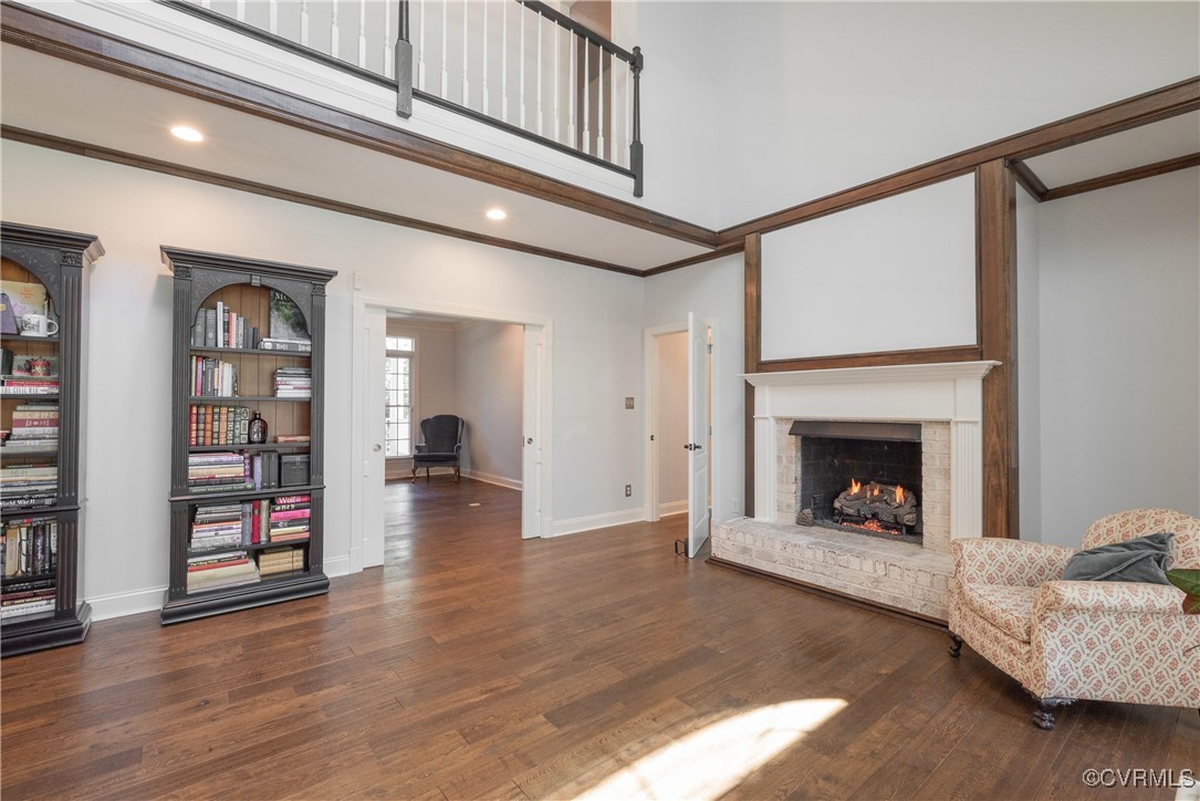 8907 First Branch Lane Chesterfield, VA 23838 - Photo 14 of 50 Living area with crown molding, a fireplace, baseb