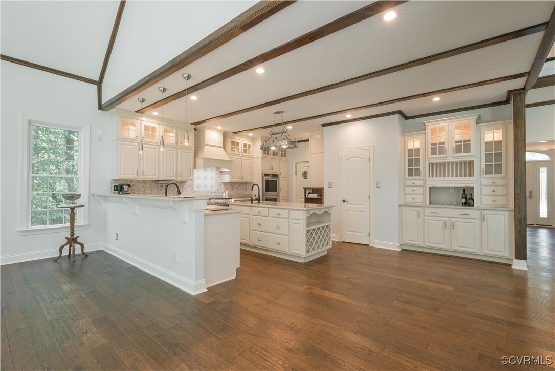 8907 First Branch Lane Chesterfield, VA 23838 - Photo 16 of 50 a large white kitchen with white cabinets and wooden floor