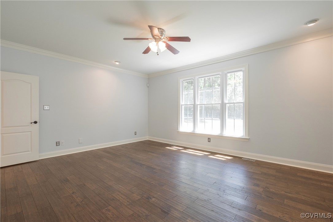 8907 First Branch Lane Chesterfield, VA 23838 - Photo 23 of 50 an empty room with wooden floor chandelier fan and windows