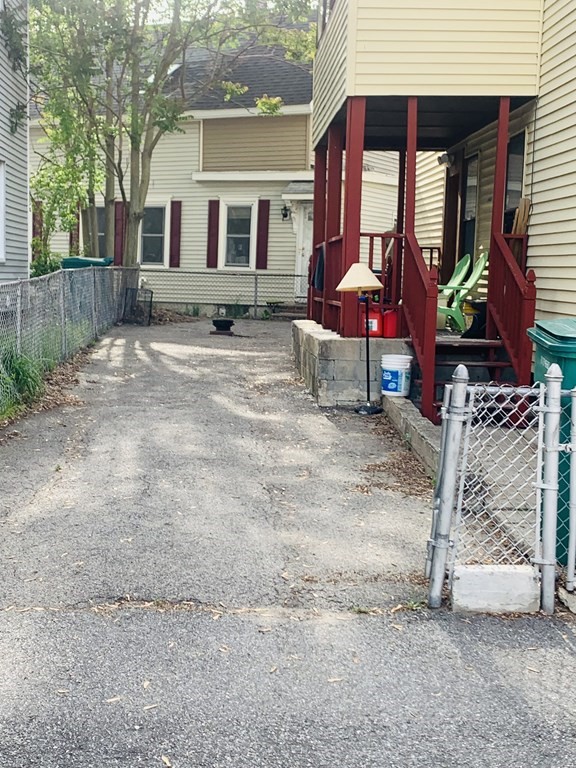30-32 Stanley Street Lowell, MA 01850 - Photo 2 of 9 a front view of house with yard