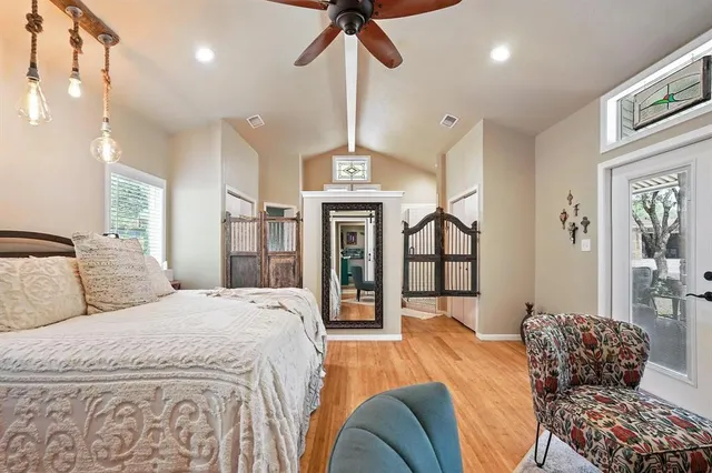 a bedroom with a bed dresser and a window