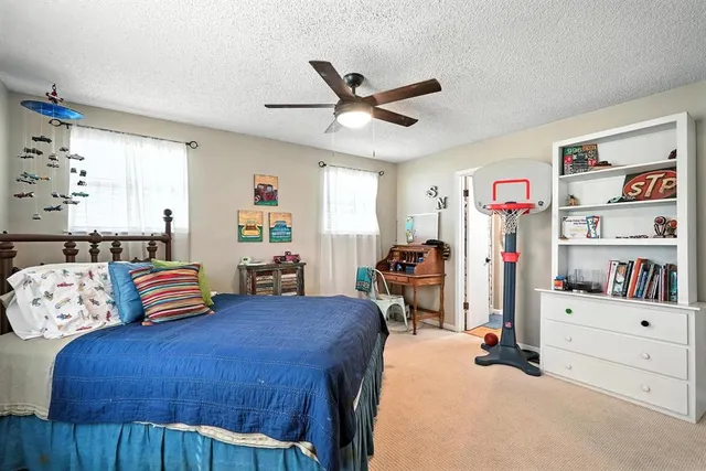 a bedroom with furniture and a bed