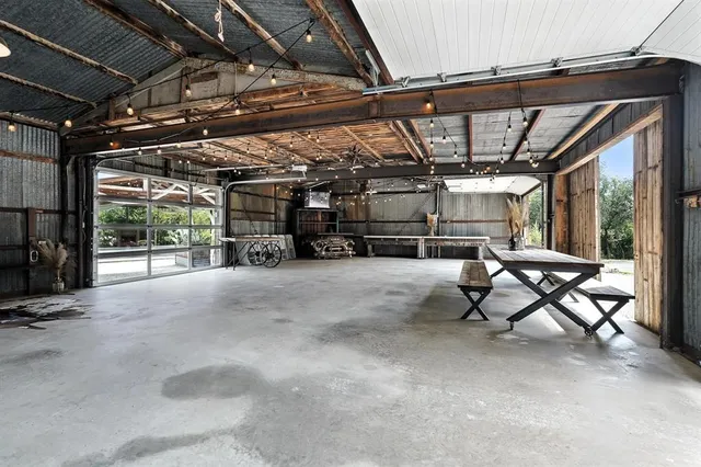 a view of pool with furniture