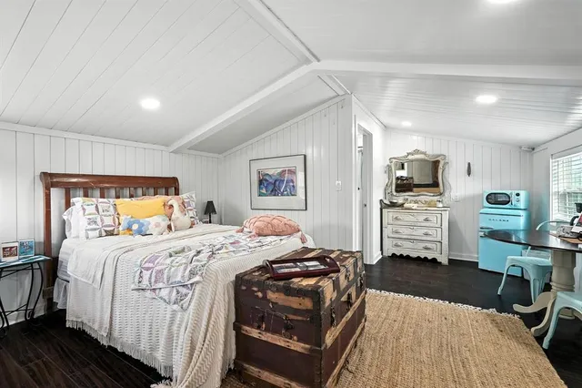 a bedroom with bed and window