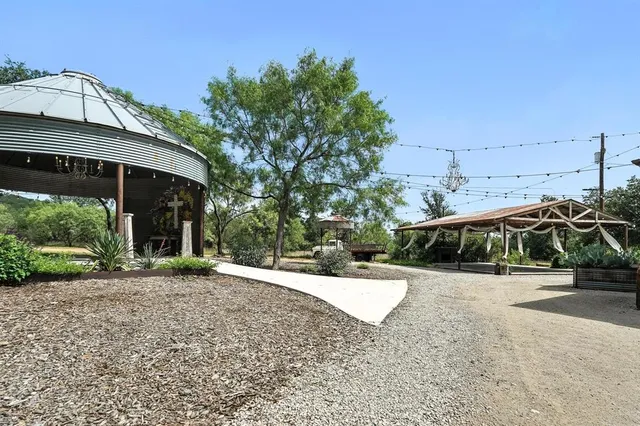 a view of a backyard with a small cabin