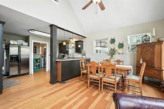 a living room with furniture a dining table and kitchen view