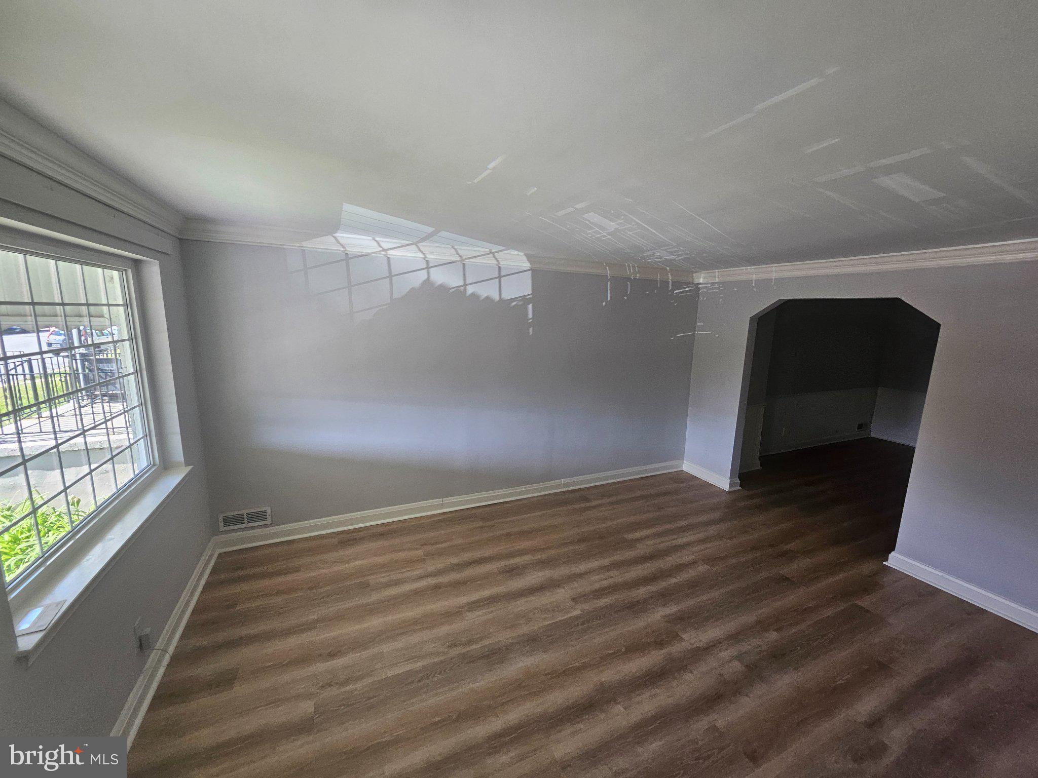635 48th Street Baltimore, MD 21224 - Photo 2 of 14 Spacious room with natural light.