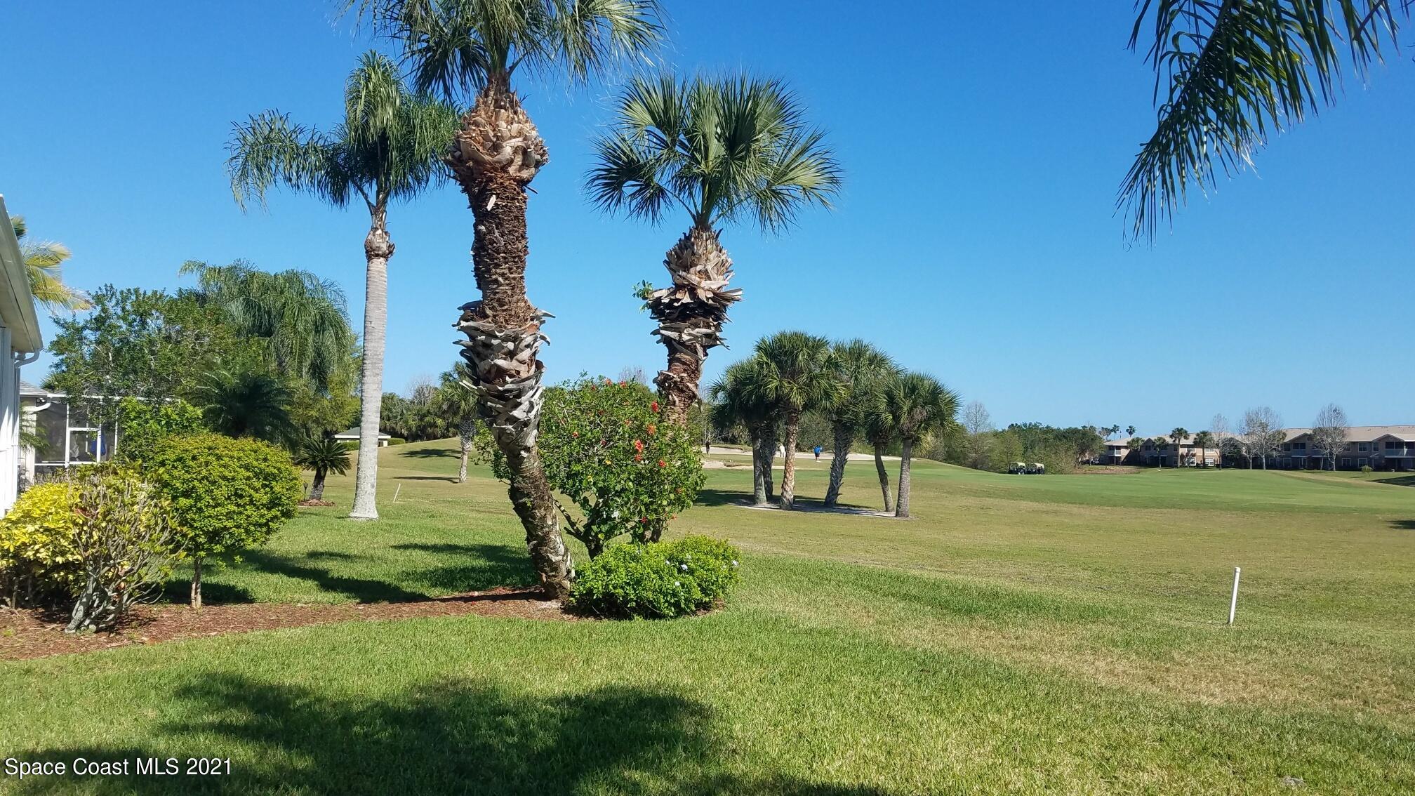 2492 Addington Circle Rockledge, FL 32955 - Photo 2 of 34 a house view with outdoor space and trees