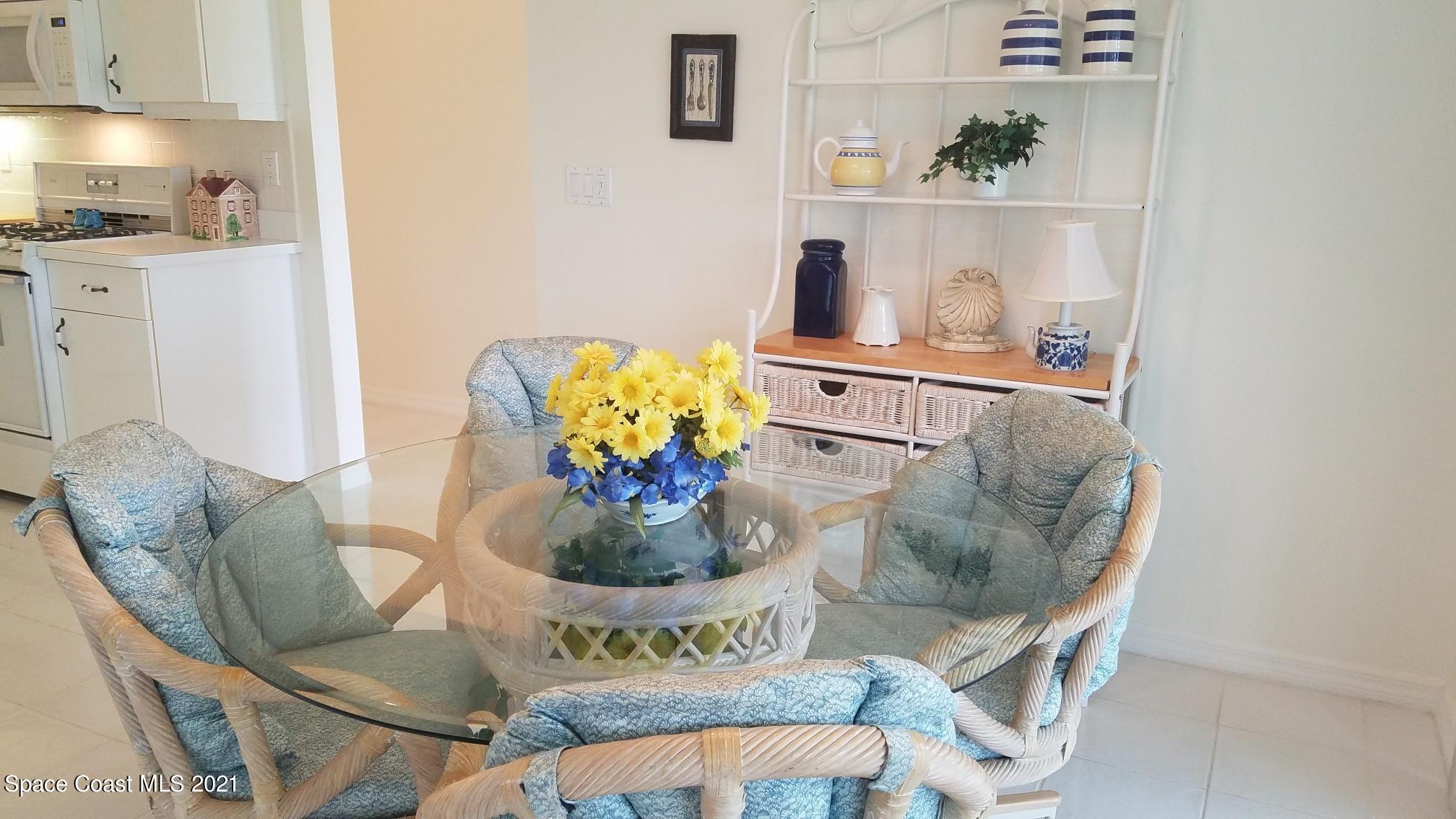 2492 Addington Circle Rockledge, FL 32955 - Photo 13 of 34 a dining room with furniture and wooden floor
