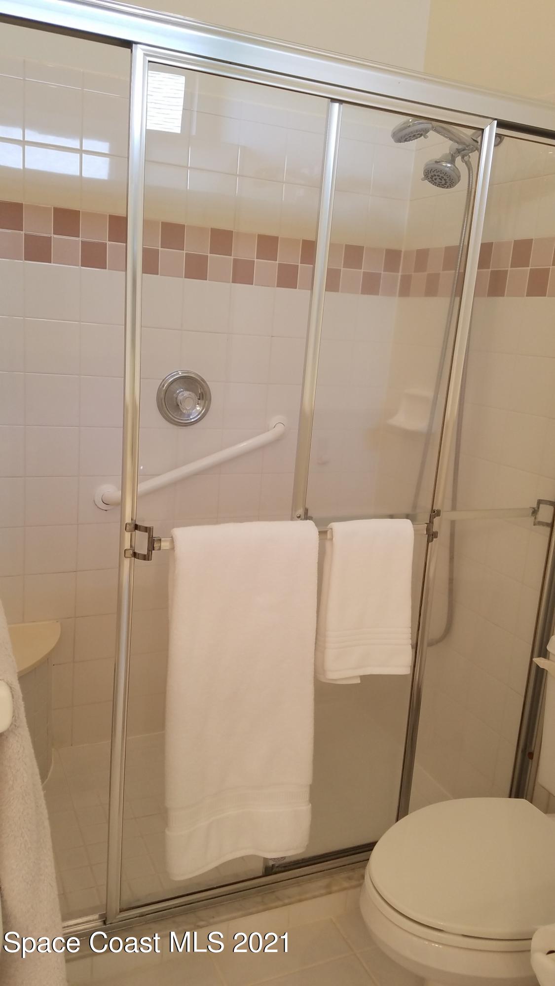 2492 Addington Circle Rockledge, FL 32955 - Photo 16 of 34 a bathroom with a toilet and a shower