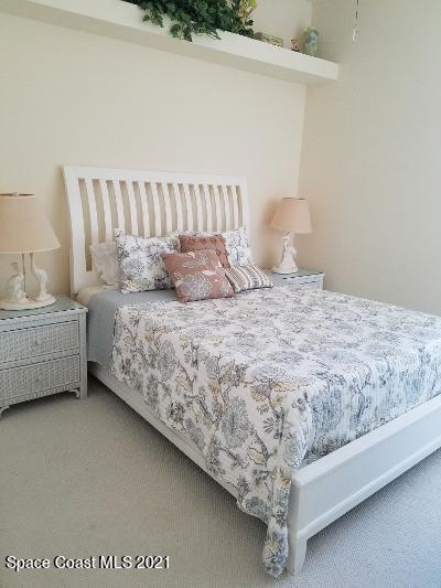 2492 Addington Circle Rockledge, FL 32955 - Photo 18 of 34 a bedroom with a bed and a couch