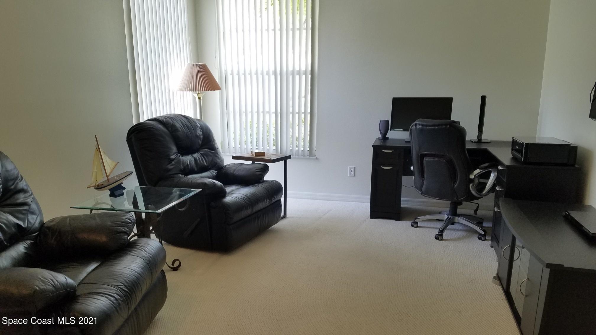 2492 Addington Circle Rockledge, FL 32955 - Photo 20 of 34 a living room with furniture and a window