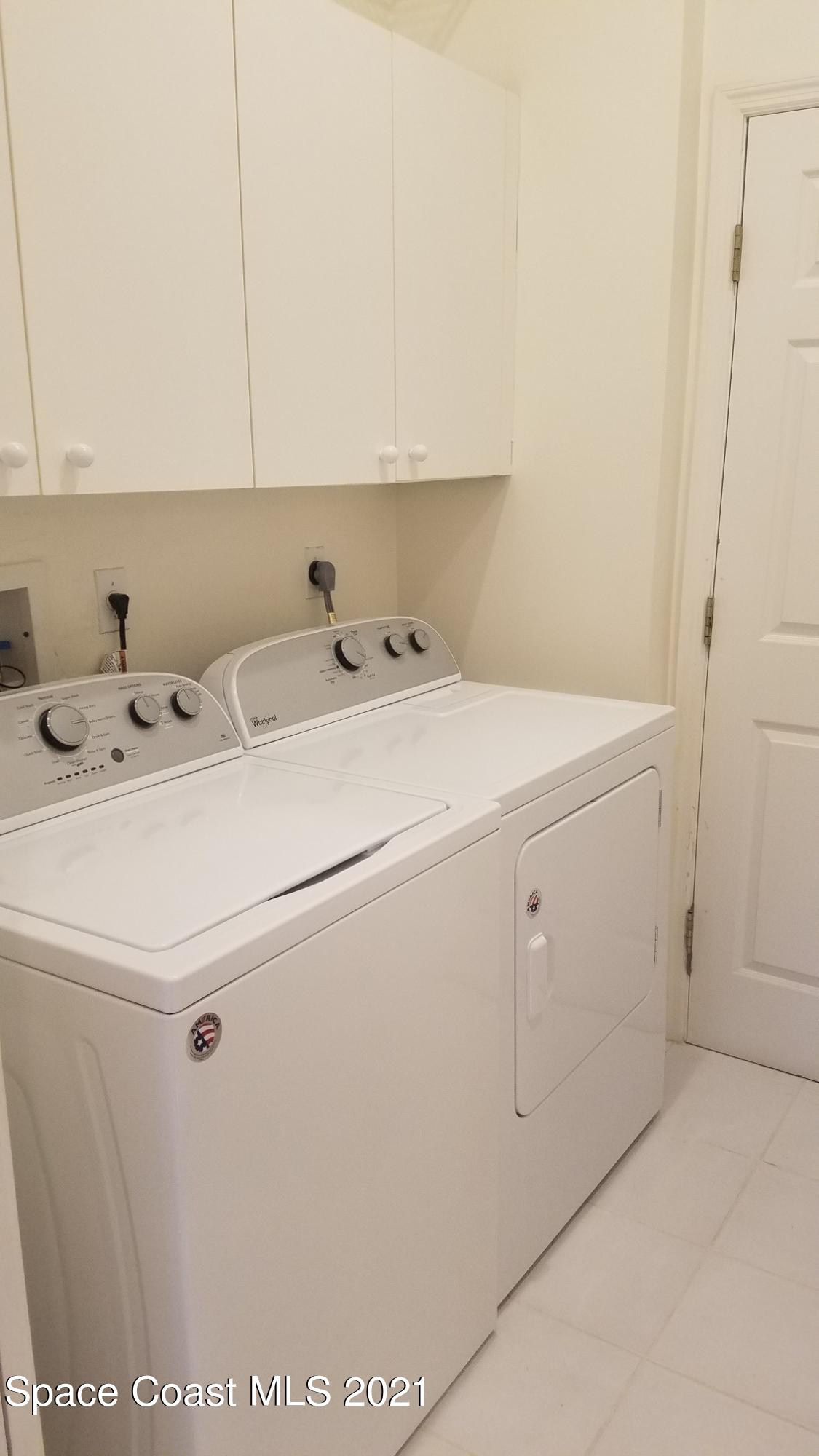 2492 Addington Circle Rockledge, FL 32955 - Photo 22 of 34 a utility room with dryer and washer