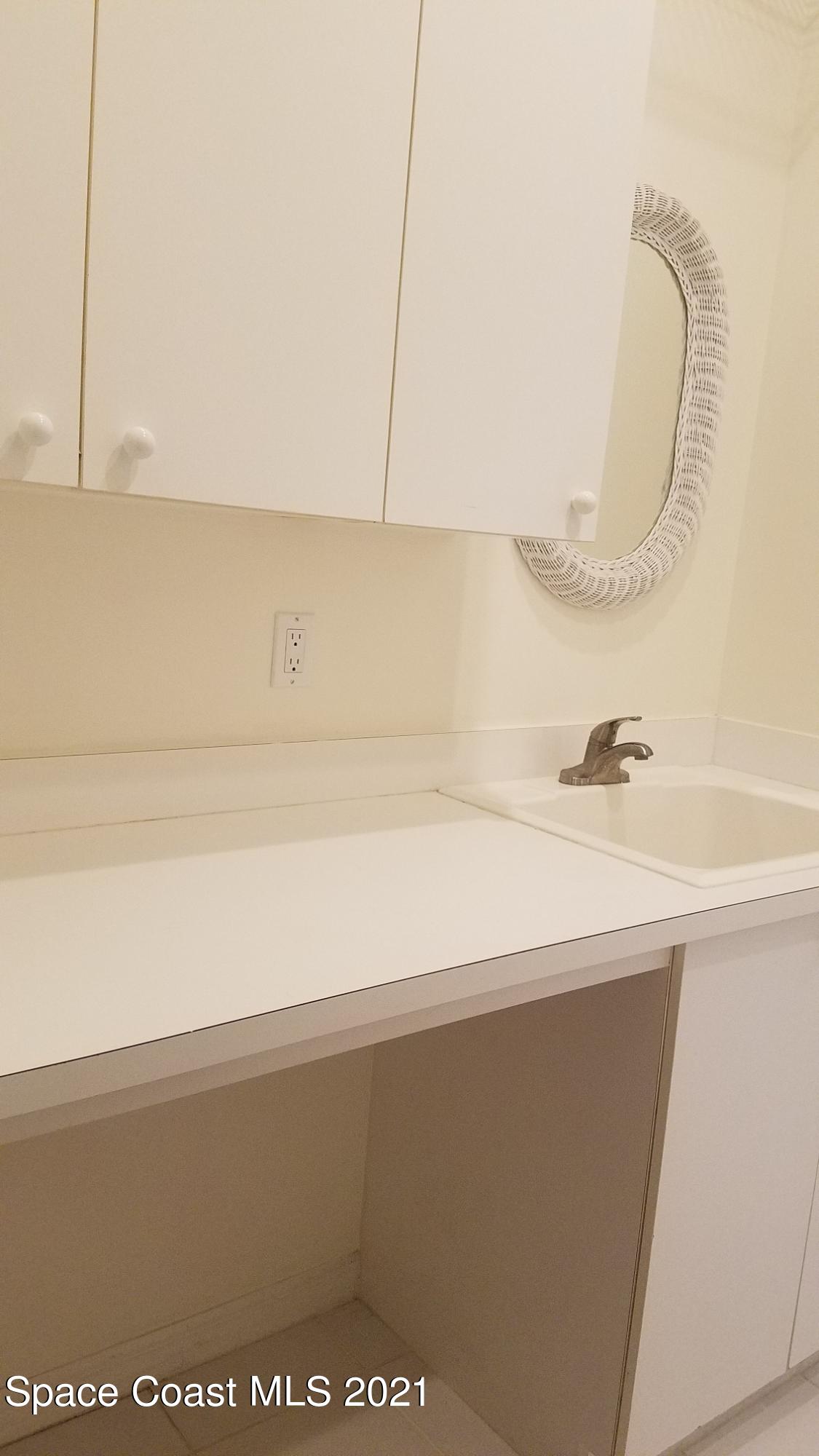 2492 Addington Circle Rockledge, FL 32955 - Photo 23 of 34 a close view of sink and tap