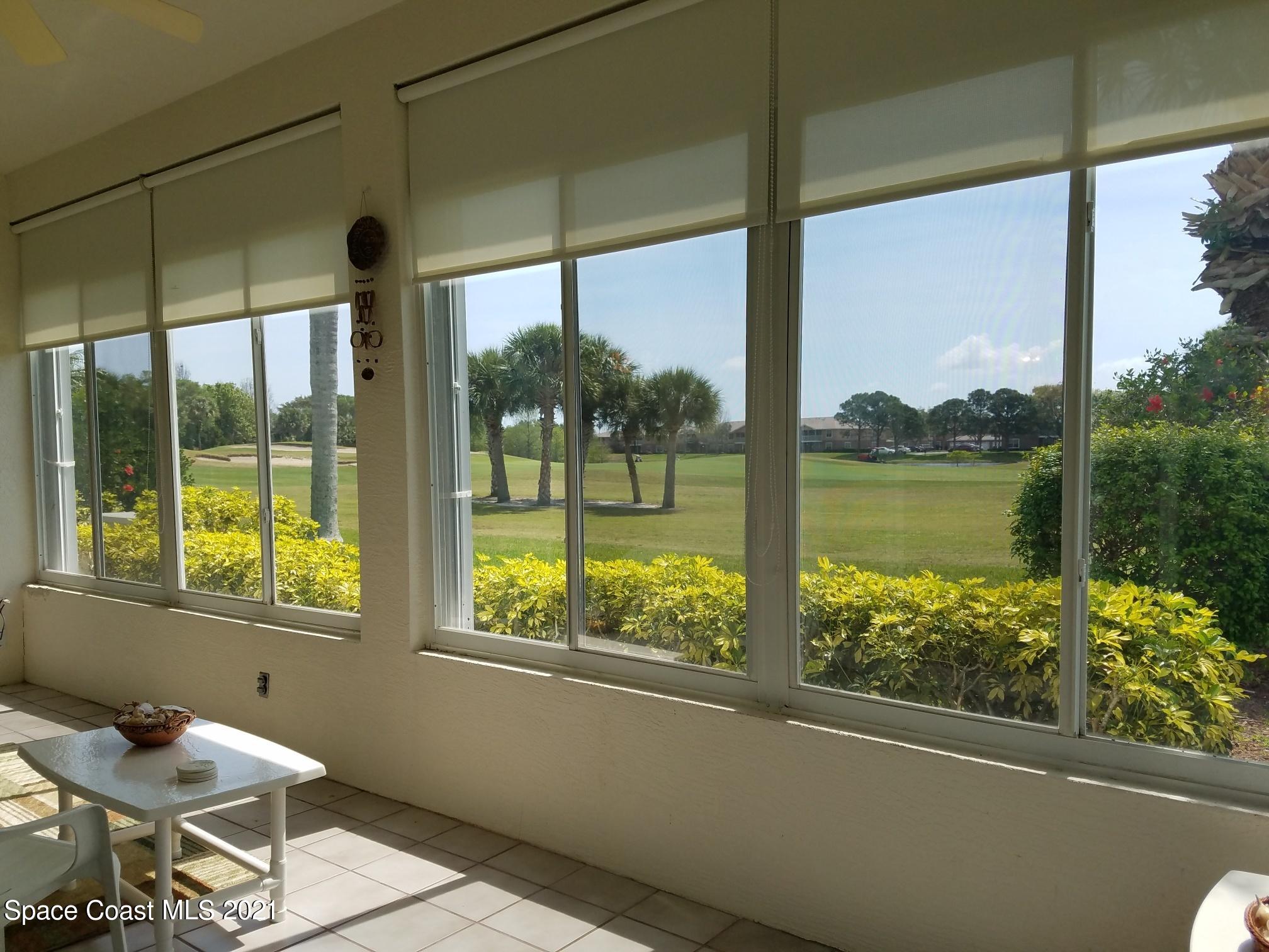 2492 Addington Circle Rockledge, FL 32955 - Photo 25 of 34 a view of a room with a floor to ceiling window and an outdoor view