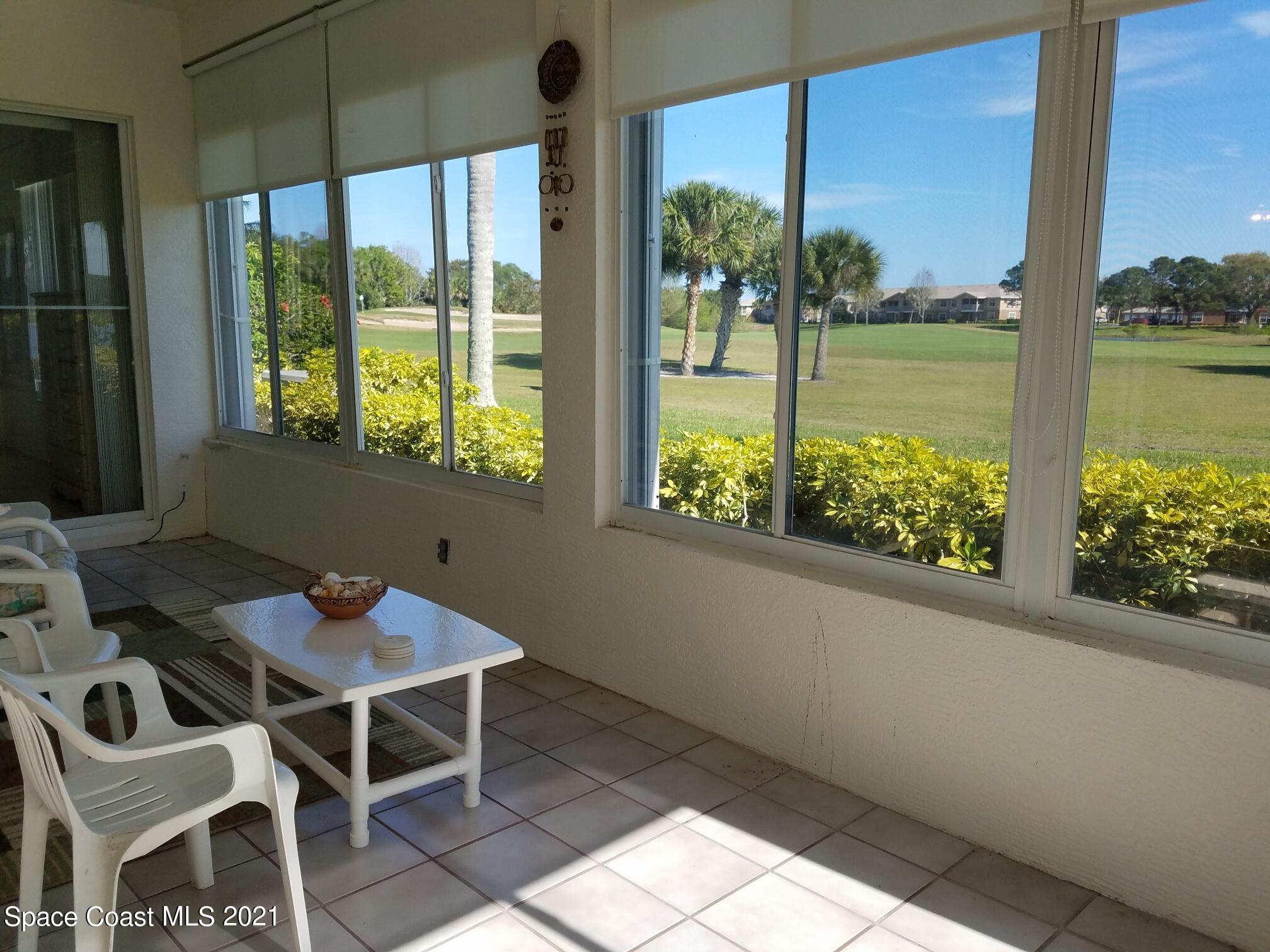 2492 Addington Circle Rockledge, FL 32955 - Photo 26 of 34 a view of a patio with a table chairs and a table