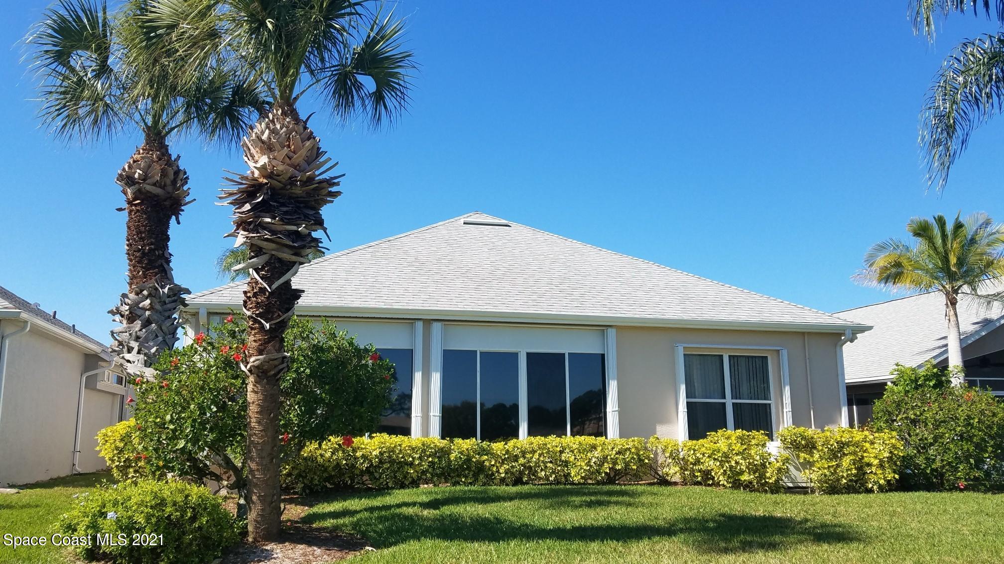 2492 Addington Circle Rockledge, FL 32955 - Photo 27 of 34 a front view of a house with a garden