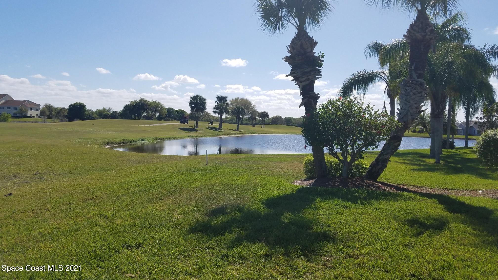 2492 Addington Circle Rockledge, FL 32955 - Photo 4 of 34 a view of a lake in a house with a lake view
