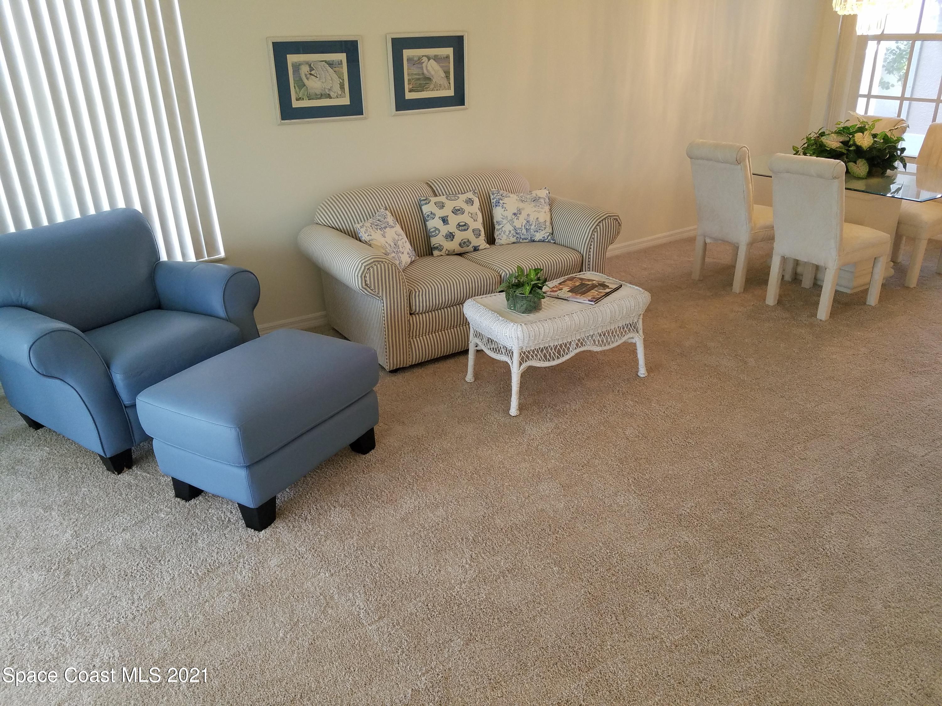 2492 Addington Circle Rockledge, FL 32955 - Photo 5 of 34 a living room with furniture and a potted plant