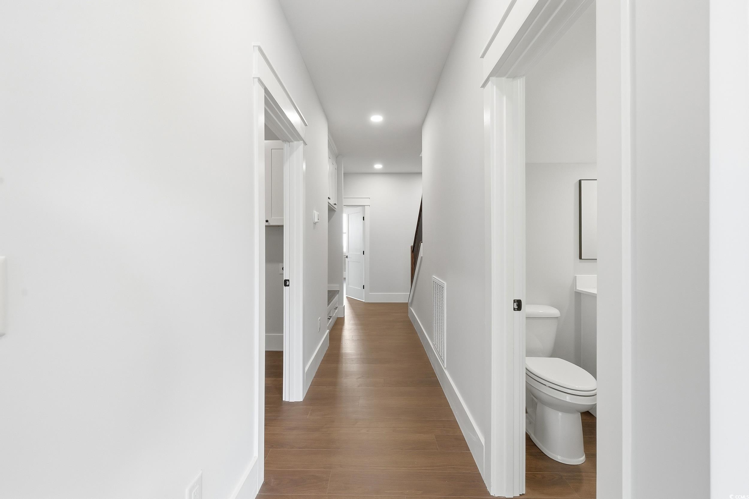 813 Commanders Island Road Georgetown, SC 29440 - Photo 11 of 39 Hall with dark wood-style floors and recessed lighting