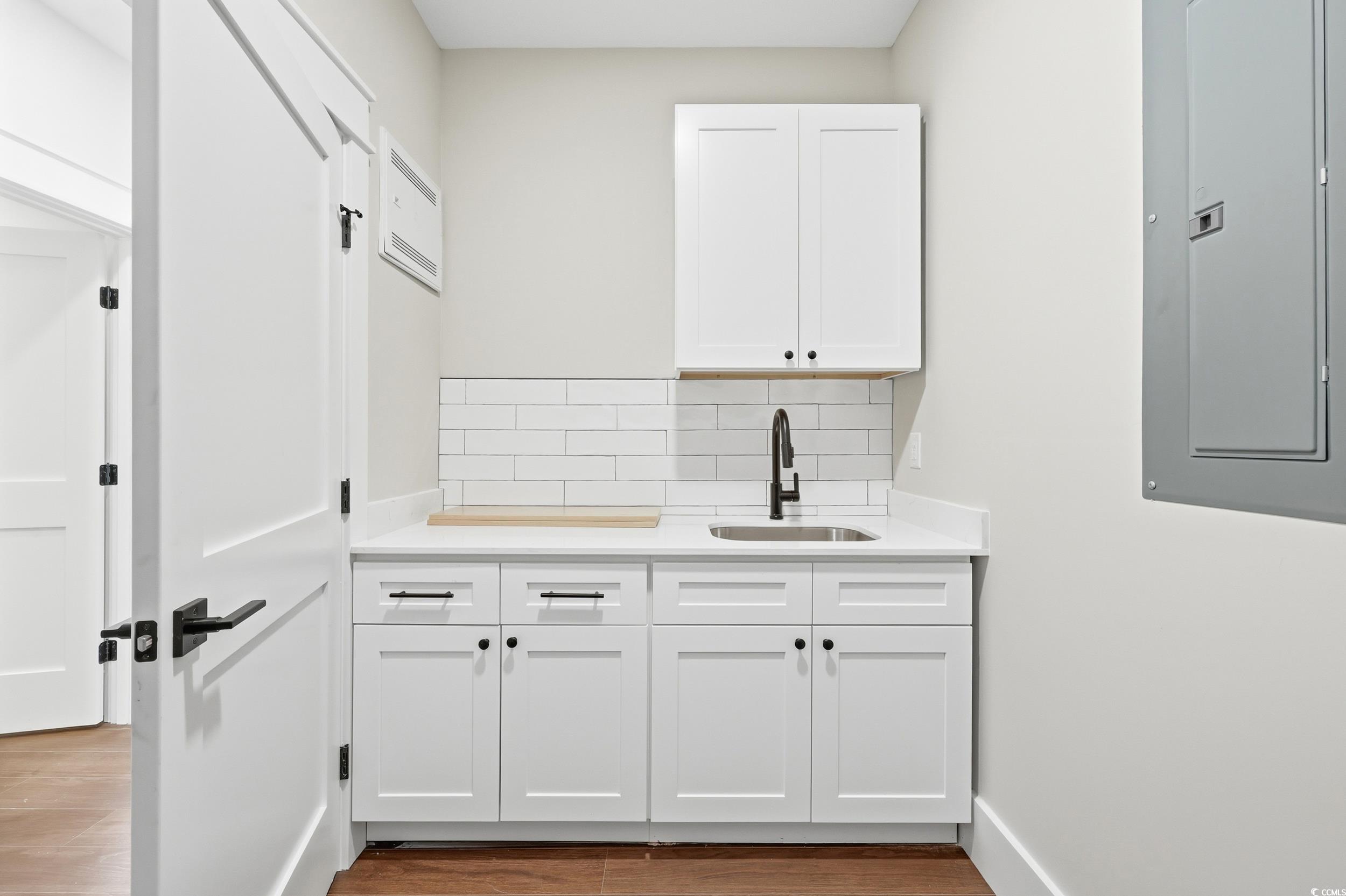 813 Commanders Island Road Georgetown, SC 29440 - Photo 14 of 39 Washroom featuring electric panel and light wood-type flooring