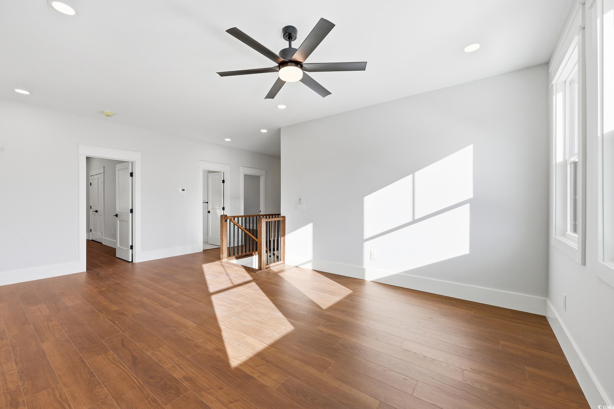 813 Commanders Island Road Georgetown, SC 29440 - Photo 21 of 39 Unfurnished living room featuring wood finished floors, a ceiling fan, and recessed lighting