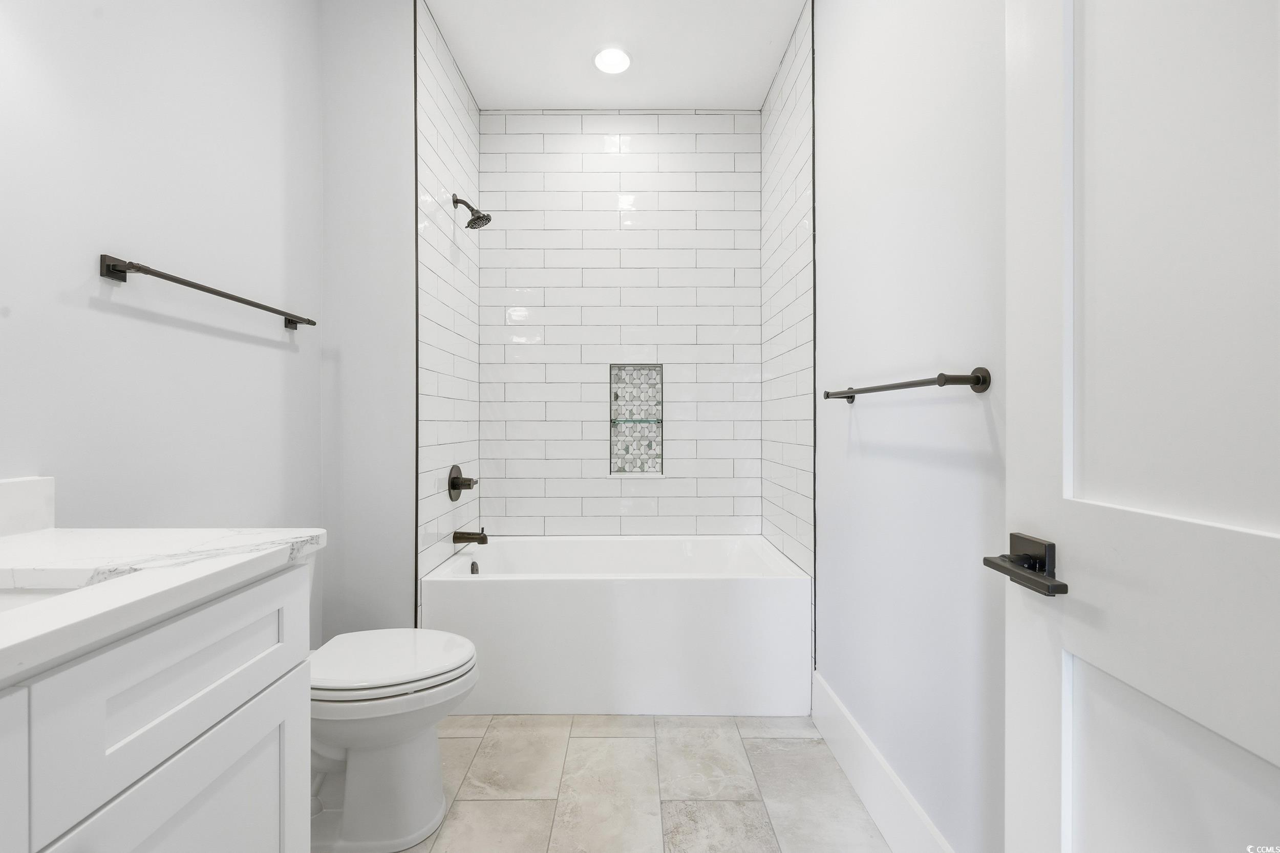 813 Commanders Island Road Georgetown, SC 29440 - Photo 25 of 39 Full bath featuring shower combination, vanity, light tile patterned flooring, and recessed lighting