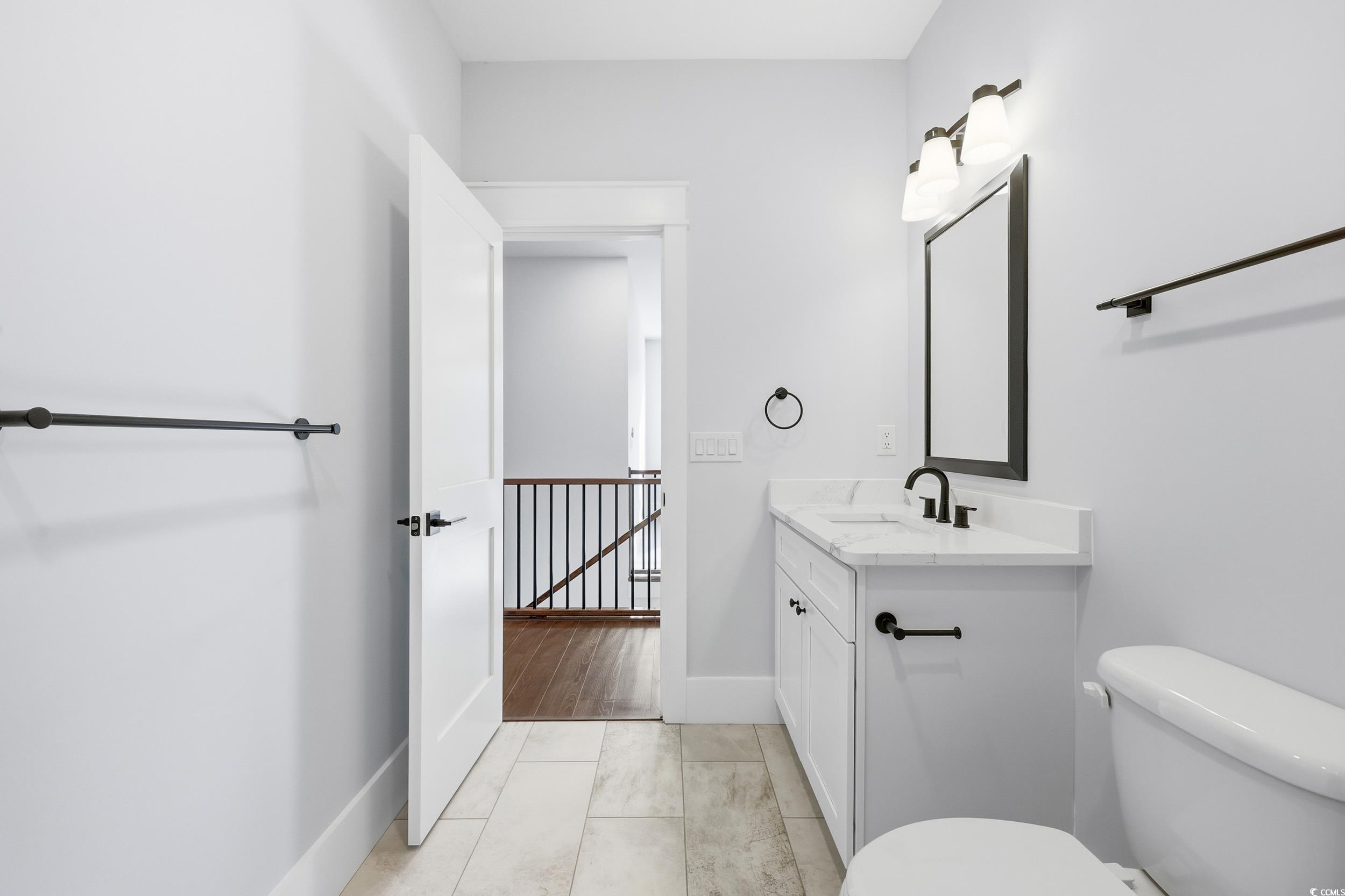813 Commanders Island Road Georgetown, SC 29440 - Photo 26 of 39 Half bathroom with vanity and light tile patterned floors