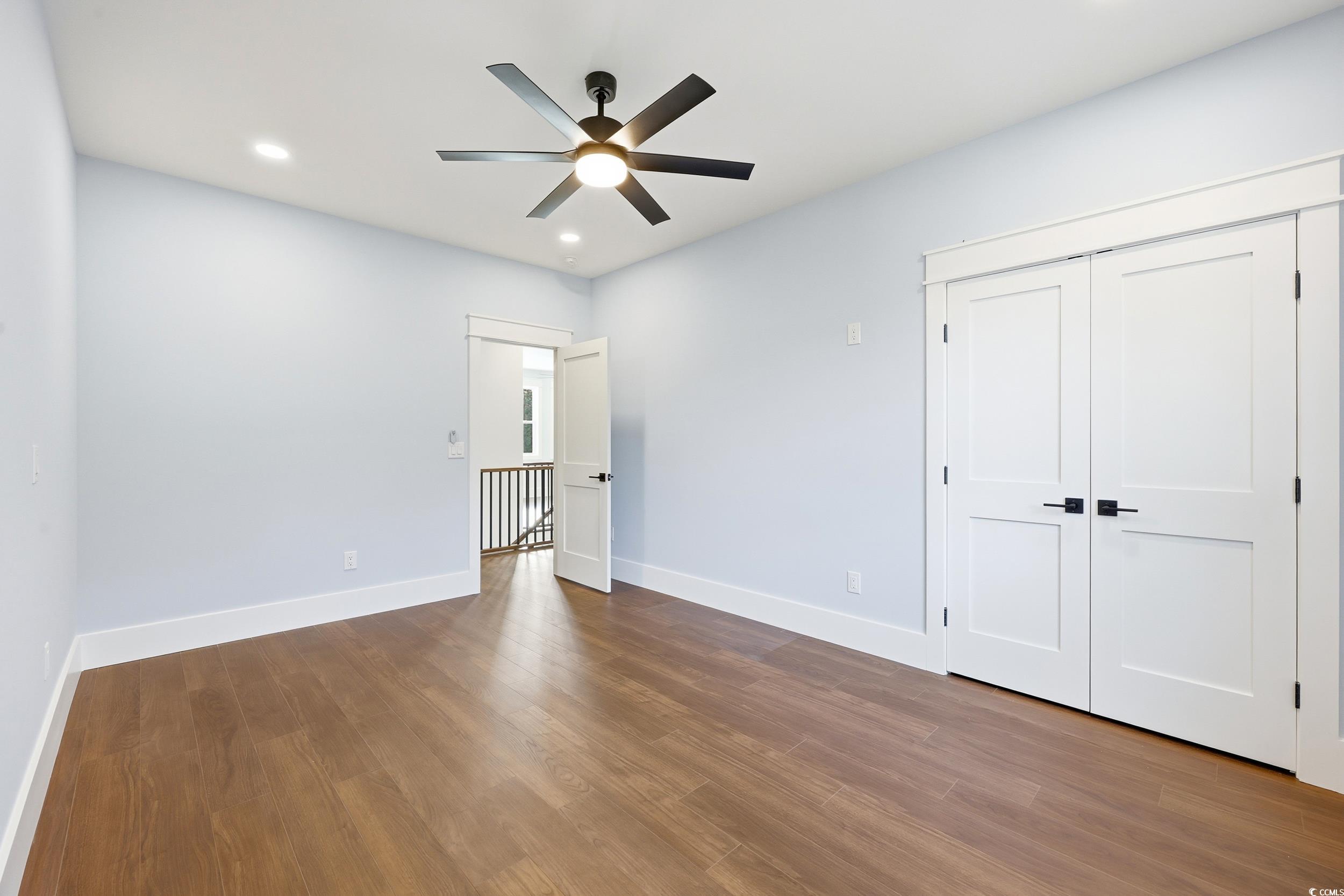813 Commanders Island Road Georgetown, SC 29440 - Photo 27 of 39 Unfurnished bedroom with dark wood finished floors, recessed lighting, a ceiling fan, and a closet