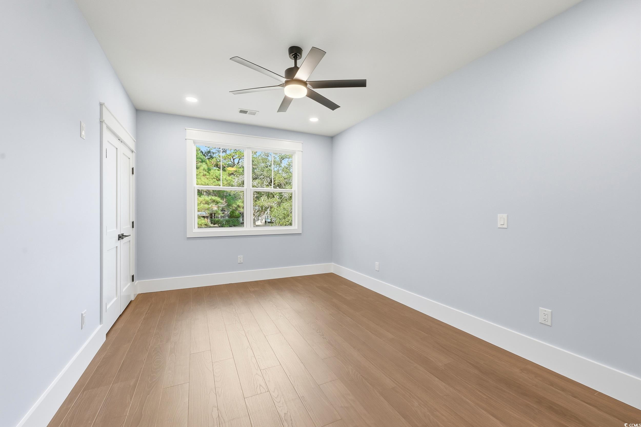813 Commanders Island Road Georgetown, SC 29440 - Photo 28 of 39 Unfurnished bedroom with light wood-type flooring, a ceiling fan, recessed lighting, and a closet