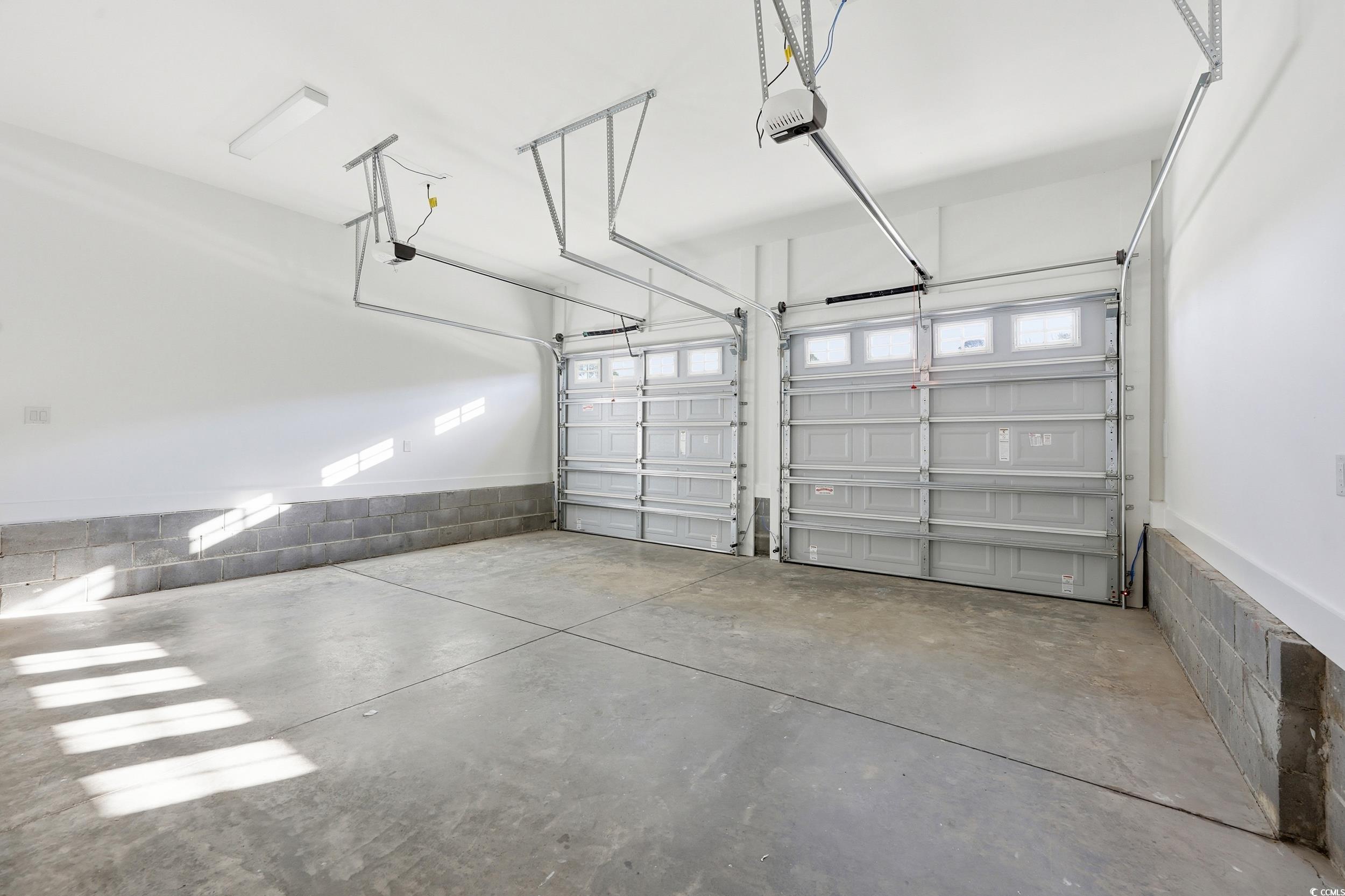 813 Commanders Island Road Georgetown, SC 29440 - Photo 34 of 39 Garage featuring a garage door opener