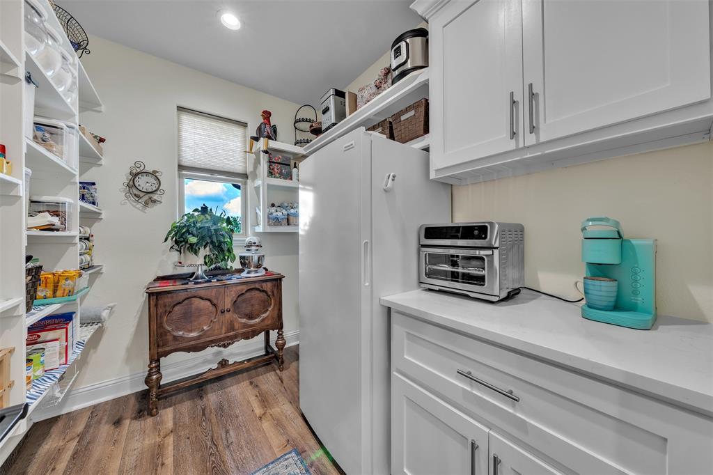 6628 Buffalo Ridge Circle Godley, TX 76044 - Photo 13 of 39 a kitchen with stainless steel appliances granite countertop a refrigerator and a stove top oven