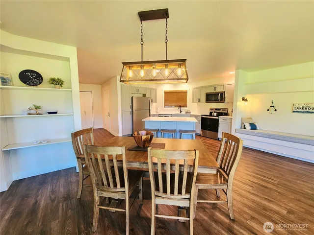 a view of a dining room with furniture and wooden floor