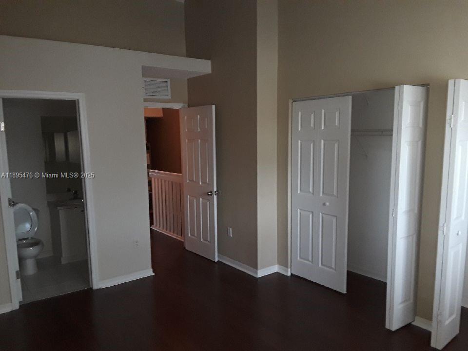 2322 Southeast 23rd Road, Unit 2322 Homestead, FL 33035 - Photo 10 of 11 a view of empty room with wooden floor