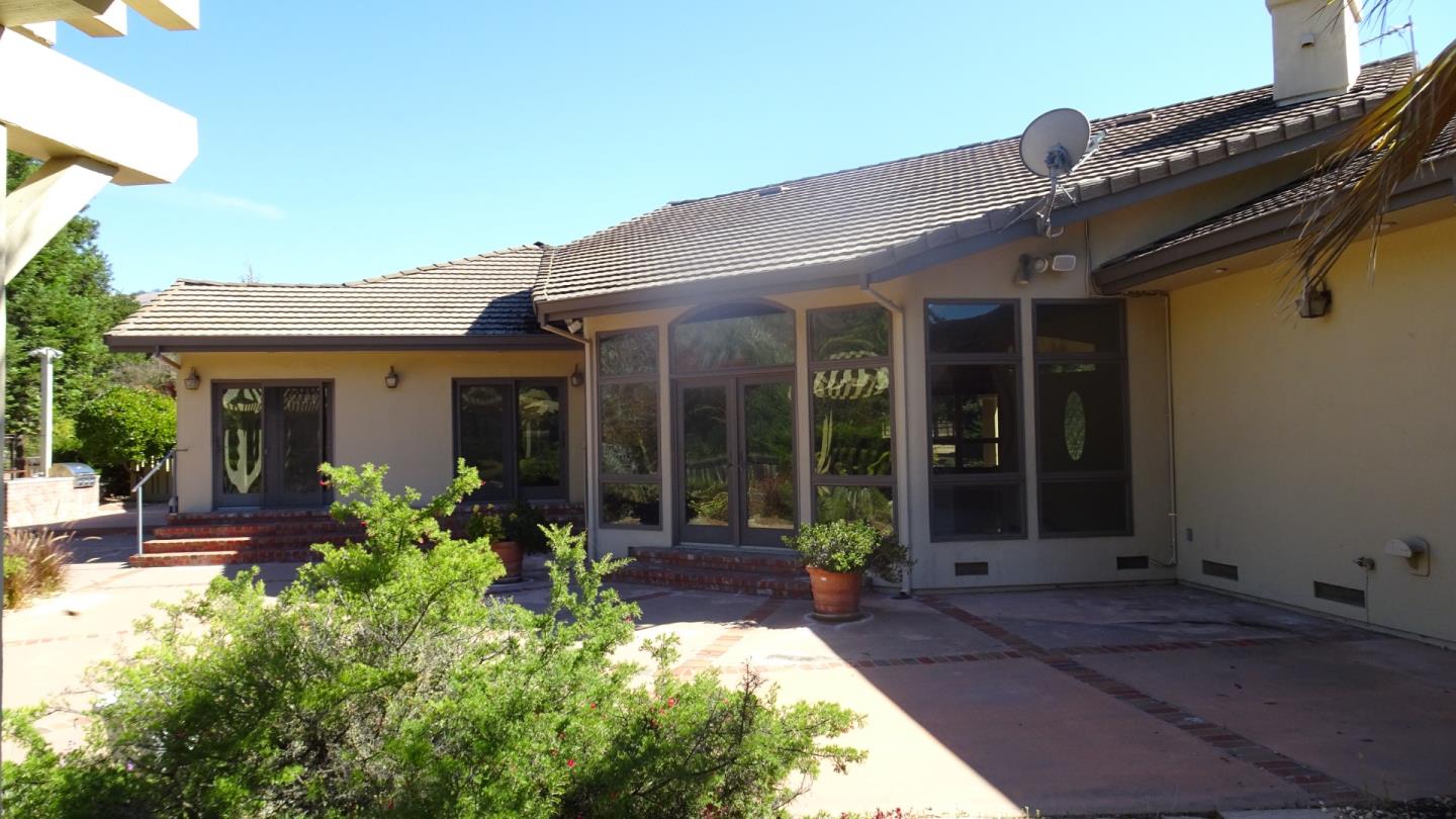 529 Corral De Tierra Road Salinas, CA 93908 - Photo 3 of 22 front view of a house with potted plants and a bench