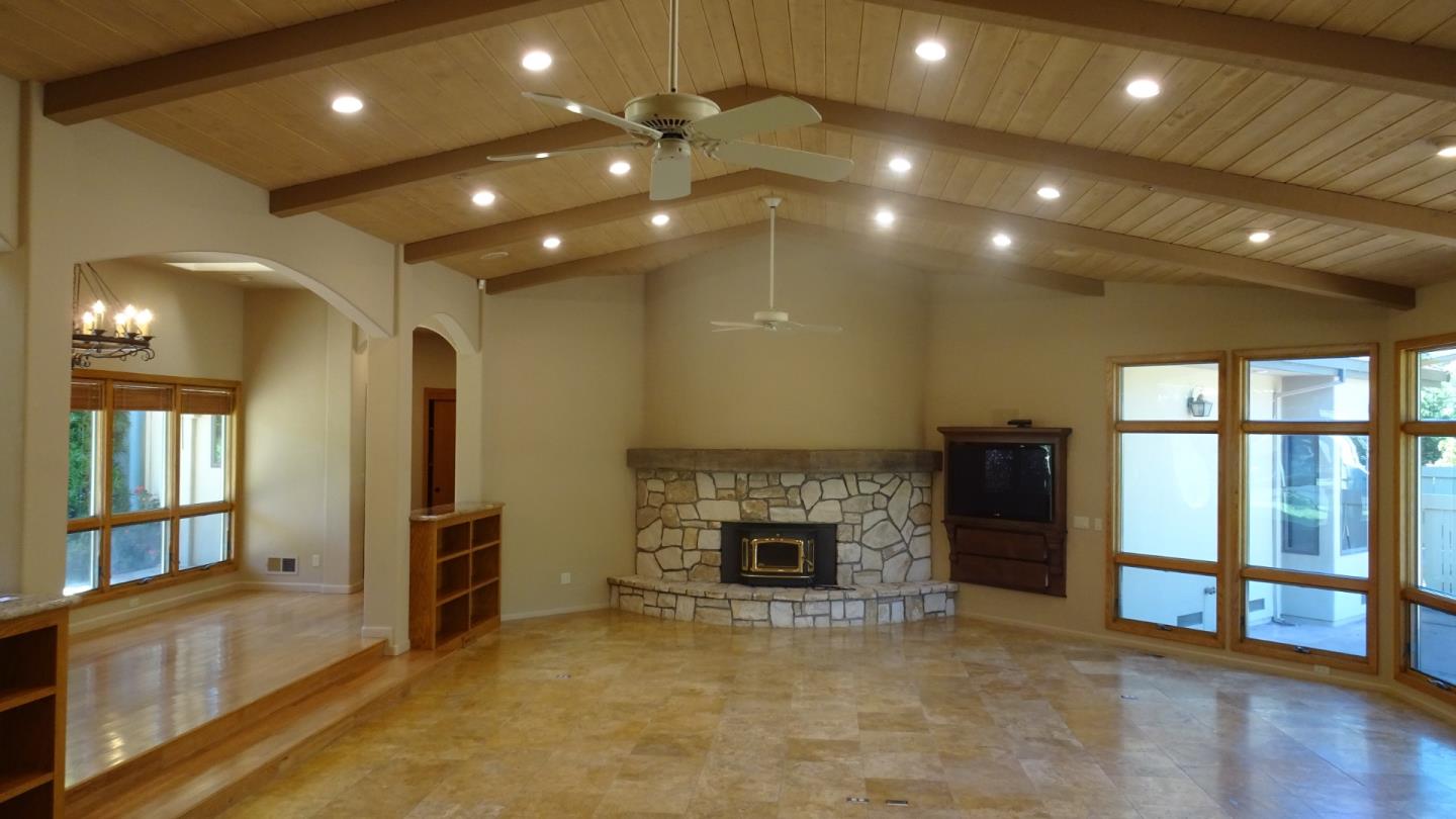 529 Corral De Tierra Road Salinas, CA 93908 - Photo 4 of 22 a view of an empty room with a fireplace and a window