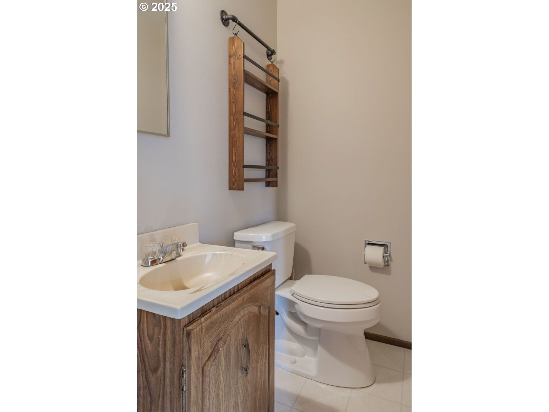 75 Northwest 22nd Street Gresham, OR 97030 - Photo 11 of 32 a bathroom with a sink toilet and a mirror