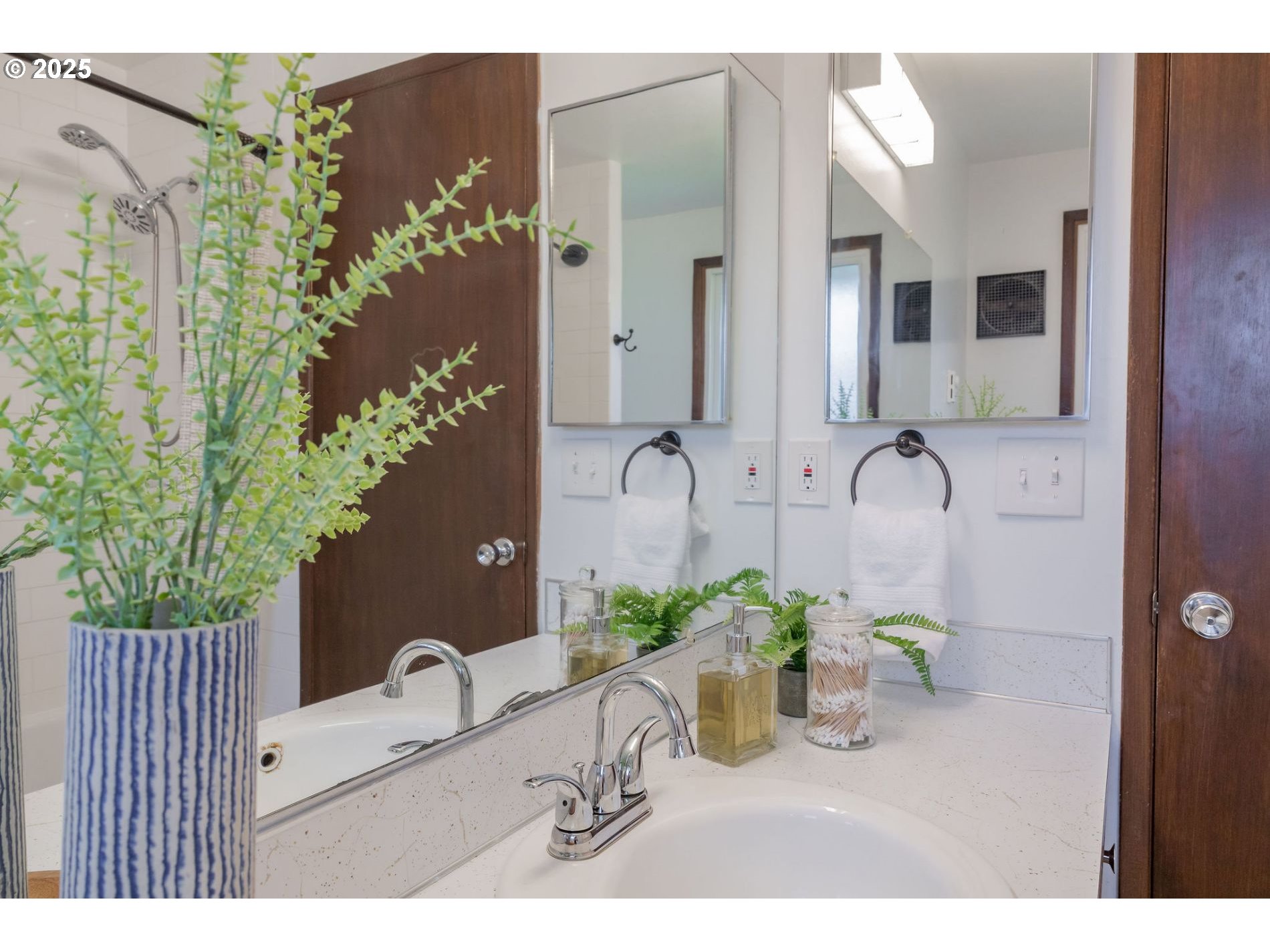75 Northwest 22nd Street Gresham, OR 97030 - Photo 16 of 32 a bathroom with a granite countertop sink a potted plant and a mirror