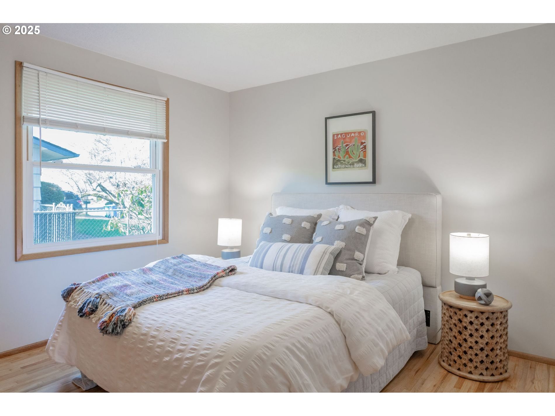 75 Northwest 22nd Street Gresham, OR 97030 - Photo 17 of 32 a bedroom with a bed and a painting on the wall